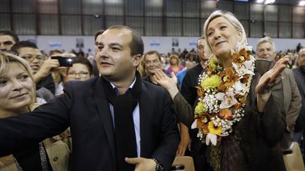 Le candidat FN &agrave; Fr&eacute;jus, David Rachline, et la pr&eacute;sidente du FN, Marine Le Pen, le 18 mars 2014. (VALERY HACHE / AFP)