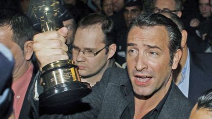 Jean Dujardin à l&#039;aéroport de Roissy, le 28 février
 (Thibault Camus/AP/SIPA)