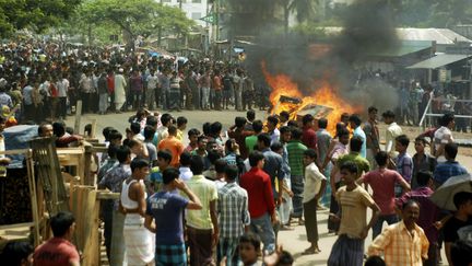 Des ouvriers du textile ont poursuivi leurs manifestations &agrave; Gazipur (Bangladesh), le 23 septembre 2013. ( REUTERS)