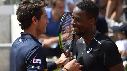 Gaël Monfils et Elliot Benchetrit. (ERIC FEFERBERG / AFP)