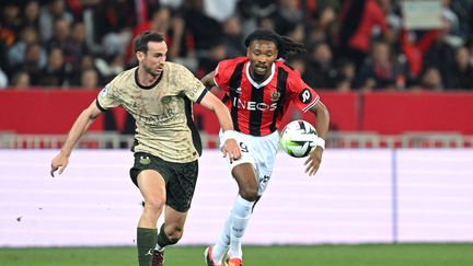 Fabian Ruiz and Kephren Thuram in contact during the Ligue 1 match between PSG and Nice, May 15, 2024. (NICOLAS TUCAT / AFP)