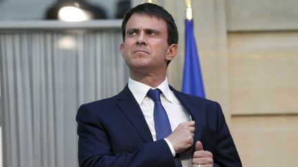 Le Premier ministre, Manuel Valls, au si&egrave;ge de l'entreprise AXA &agrave; Paris, le 24 juin 2014. (THOMAS SAMSON / AFP)