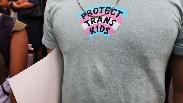 A person wears a T-shirt supporting trans children in New York City on June 24, 2022. (MICHAEL M. SANTIAGO / GETTY IMAGES NORTH AMERICA)