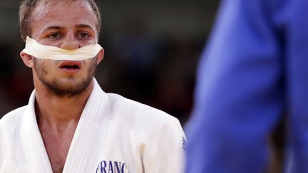 La judoka fran&ccedil;ais Ugo Legrand avec le nez band&eacute; apr&egrave;s avoir &eacute;t&eacute; bless&eacute; lors des rondes &eacute;liminatoires le 30 juillet 2012 aux JO de Londres.&nbsp; (TORU HANAI / REUTERS)