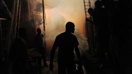 Désinsectisation d'un quartier de Port-au-Prince (Haïti). (HECTOR RETAMAL / AFP)