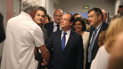  (François Hollande lors d'une visite à l'hôpital Necker de Paris en juillet 2013 © Maxppp)