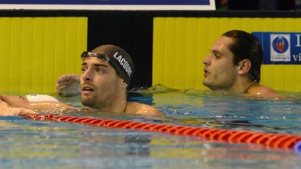 Les deux nageurs marseillais, Camille Lacourt (à gauche) et Florent Manaudou. (JEAN PIERRE MULLER / AFP)