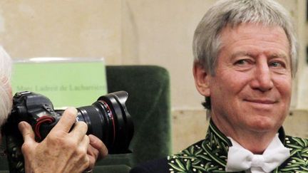 Régis Wargnier photographié par Yann Arthus-Bertrand à la cérémonie de l&#039;Académie des Beaux Arts
 (François Guillot / AFP)