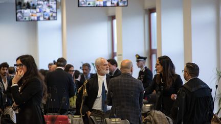 Lawyers wait for the verdict to be read on November 20, 2023, in Lamezia Terme (Italy).  (GIANLUCA CHININEA / AFP)