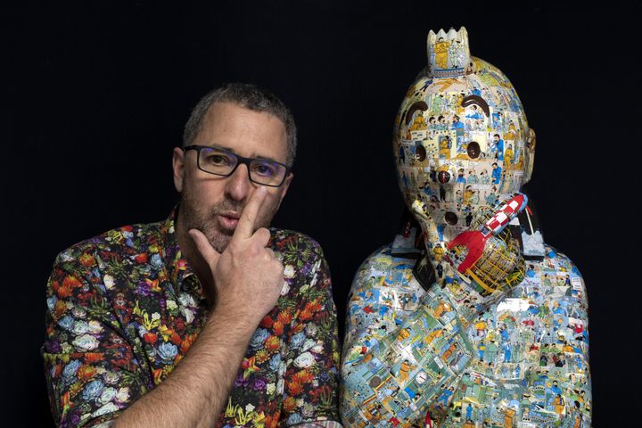 L'artiste Christophe Tixier, alias Peppone, pose à côté d'une de ses oeuvres à La Roque d'Antheron, le 13 avril 2021. (CHRISTOPHE SIMON / AFP)