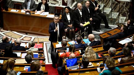 Le ministre de l'Intérieur, Gérald Darmanin, à l'Assemblée nationale, le 19 décembre 2023. (JULIEN DE ROSA / AFP)