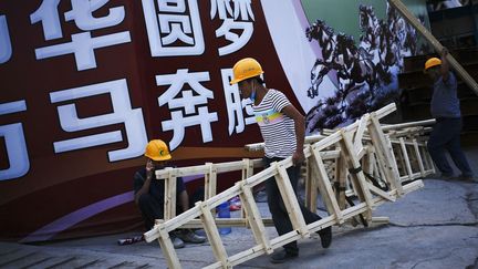 Un rêve assombri par le poids colossal de la dette des entreprises chinoises, soit 165% du PIB en 2015. Une situation exceptionnelle dans un pays émergent. (SIPA/AP Photo/Andy Wong)