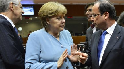 Angela Merkel et Fran&ccedil;ois Hollande, le 23 mai 2012 &agrave; Bruxelles. (BENOIT DOPPAGNE / BELGA MAG)