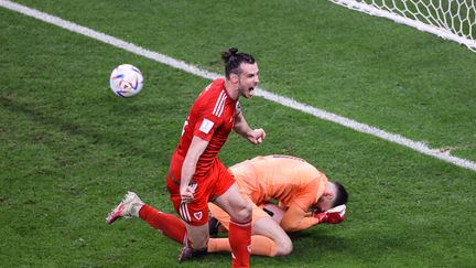 L'explosion de joie de Gareth Bale, qui égalise face aux Américains, lors du match de Coupe du monde entre le pays de Galles et les Etats-Unis, le 21 novembre 2022. (ADRIAN DENNIS / AFP)