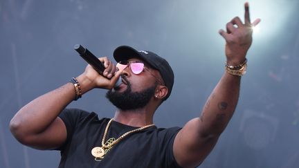 Le rappeur Damso lors d'un concert aux Vieilles Charrues, le 21 juillet 2017, à Carhaix (Finistère). (HUGO MARIE / EPA)