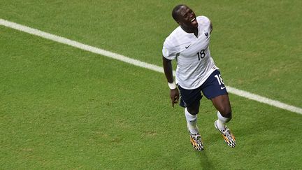 Le milieu de terrain Moussa Sissoko c&eacute;l&egrave;bre son but contre la Suisse,&nbsp;&agrave; Salvador de Bahia, 20 juin 2014. (DIMITAR DILKOFF / AFP)