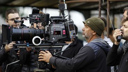 Le cinéaste Luc Besson, ici pendant le tournage de "Lucy" en 2014.
 (LILO/SIPA)