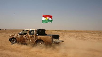  (Une voiture de l'armée kurde © Reuters-Youssef Boudlal)