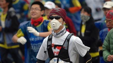 Un participant au marathon de Pékin 2014 (STR / AFP)