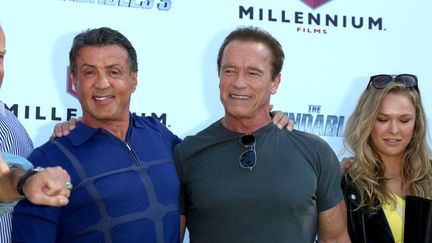 Sylvester Stallone,&nbsp;Arnold Schwarzenegger et Ronda Rousey pr&eacute;sentent le film "Expandables 3", lors de la 67e &eacute;dition du Festival de Cannes, le 18 mai 2014. (HUBERT BOESL / DPA / AFP)