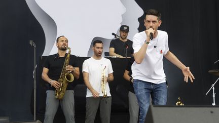 Le collectif de rap nantais Hocus Pocus avec 20Syl au micro, lors de la 21e édition du festival Solidays à l'hippodrome de Longchamp, le 23 juin 2019. (SADAKA EDMOND/SIPA)