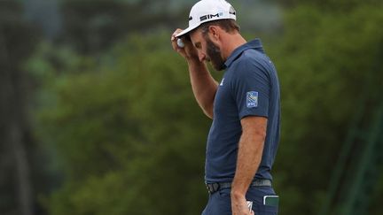 Dustin Johnson est devenu le 11e tenant du titre à ne pas passer le cut après deux tours dans l'histoire du Majeur, vendredi 9 avril. (KEVIN C. COX / GETTY IMAGES NORTH AMERICA)