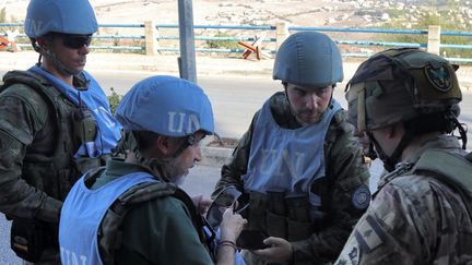 Des Casques bleus espagnols dans le sud du Liban le 8 octobre 2024 (- / AFP)