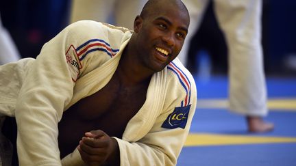 Teddy Riner garde le sourire (MARTIN BUREAU / AFP)