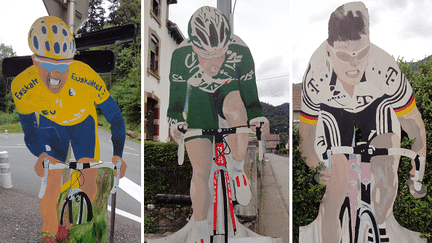 Des panneaux de bois &agrave; l'effigie d'anciens coureurs du Tour de France, comme l'Allemand Jan Ullrich (&agrave; droite), dans les rues de Plancher-les-Mines (Haute-Sa&ocirc;ne), le 23 juin 2015. (PIERRE GODON / FRANCETV INFO)