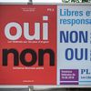 Une affiche électorale lors d'un vote populaire en juin 2018 en Suisse.&nbsp; (FABRICE COFFRINI / AFP)