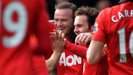 Wayne Rooney et Juan Mata (Manchester United) (PAUL ELLIS / AFP)