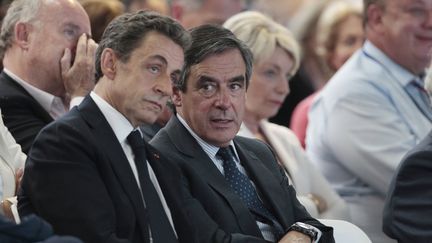 Nicolas Sarkozy et François Fillon, le 30 mai 2015 à Paris. (CHARLY TRIBALLEAU / AFP)