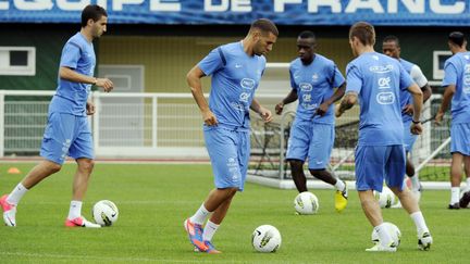 Etienne Capoue et Maxime Gonalons à Clairefontaine (BERTRAND GUAY / AFP)