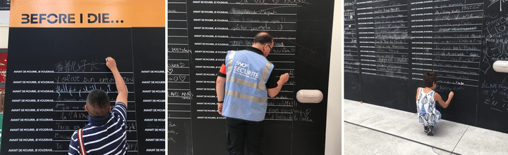 Un touriste, un agent et un enfant rédigent des vœux sur les tableaux installés dans le hall de la gare de Lyon à Paris, mardi 9 août 2016. (F. MAGNENOU / FRANCETV INFO)