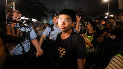 Le militant prodémocratie Joshua Wong, lors d'une manifestation à Hong Kong, le 7 juillet 2019. (VIVEK PRAKASH / AFP)