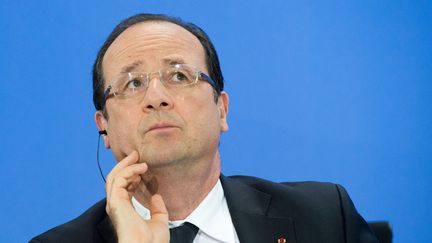 Fran&ccedil;ois Hollande, lors d'une conf&eacute;rence sur le ch&ocirc;mage des jeunes en Europe, le 3 juillet &agrave; Berlin (Allemagne). (MAURIZIO GAMBARINI / DPA / AFP)