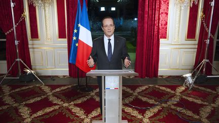 Fran&ccedil;ois Hollande lors de ses v&oelig;ux aux Fran&ccedil;ais, le 31 d&eacute;cembre 2012 &agrave; l'Elys&eacute;e, &agrave; Paris.&nbsp; (LIONEL BONAVENTURE / AFP)