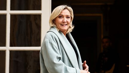 La présidente du groupe RN à l'Assemblée nationale, Marine Le Pen, à Matignon, le 11 avril 2023. (ANNE-CHRISTINE POUJOULAT / AFP)