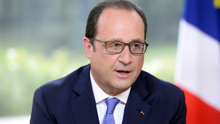 Le pr&eacute;sident Fran&ccedil;ois Hollande, le 14 juillet 2015, lors de son interview du 14-Juillet, &agrave; l'Elys&eacute;e, &agrave; Paris. (  REUTERS)