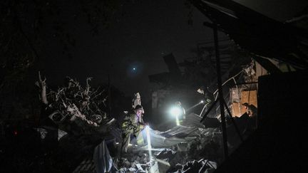 Ukrainian emergency services conduct a search operation among the rubble of a hotel destroyed by a Russian strike in the city of Kramatorsk on the night of August 24-25, 2024. (GENYA SAVILOV / AFP)