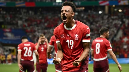 Dan Ndoye celebrating his goal against Germany with Switzerland, Euro 2024, June 23, 2024 (ANGELOS TZORTZINIS / AFP)