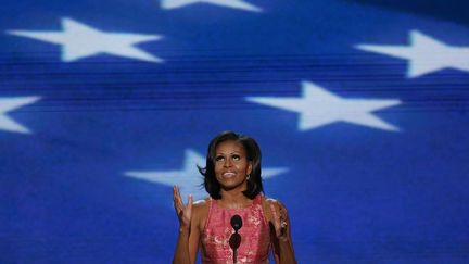 La Premi&egrave;re dame des Etats-Unis, Michelle Obama, a exhort&eacute; les Am&eacute;ricains &agrave; voter une nouvelle fois pour son mari, lors du premier jour de la convention d&eacute;mocrate, &agrave; Charlotte (Caroline du Nord), le 4 septembre 2012.&nbsp; (JASON REED / REUTERS )