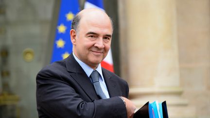 Le ministre de l'Economie, Pierre Moscovici, &agrave; l'Elys&eacute;e, &agrave; Paris,&nbsp;le 23 d&eacute;cembre 2013. (BERTRAND GUAY / AFP)