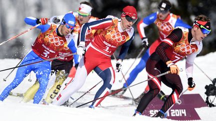 Harald Wurm (N.7) devant le Norvégien Ola Vigen Hattestad et l'Italien Federico Pellegrino, lors des derniers JO à Sotchi (ODD ANDERSEN / AFP)