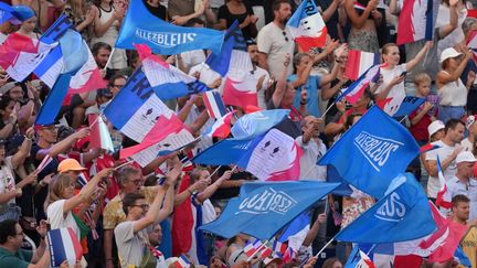 Supporters in the stands on August 1, 2024, during the preliminary stages of beach volleyball at the Paris Games, at the foot of the Eiffel Tower. (LECOCQ CEDRIC / KMSP / AFP)