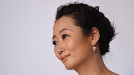 L'actrice chinoise est l'une des interprètes de "Shan He Gu Ren" ("Mountains May Depart") présenté en compétition officielle. 
 (AFP PHOTO / ANNE-CHRISTINE POUJOULAT)