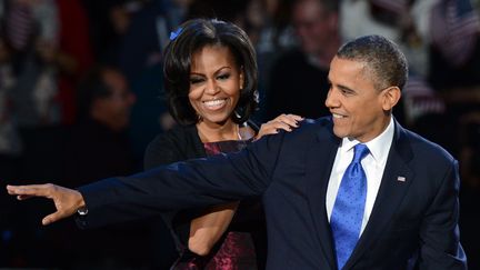 Barack et Michelle Obama en 2012 à Chicago où de nombreux habitants souhaitent le retour du couple, après la prochaine présidentielle (SAUL LOEB / AFP)