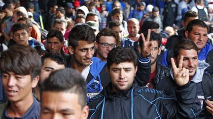 Migrants juste descendus du train après être arrivés par train en gare de Munich (Bavière) le 13 septembre 2015 (REUTERS - Michaela Rehle)