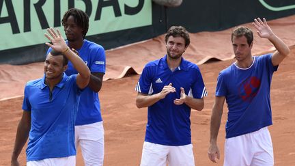 Jo-Wilfried Tsonga, Gaël Monfils, Gilles Simon et Richard Gasquet saluent le public du premier tour de Coupe Davis France-Canada, le 6 mars 2016 à Baie-Mahault (Guadeloupe). (MIGUEL MEDINA / AFP)