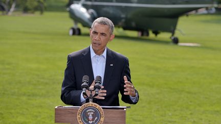 Barack Obama sur la pelouse de la Maison Blanche, &agrave; Washington, samedi 9 ao&ucirc;t 2014. (MANDEL NGAN / AFP)